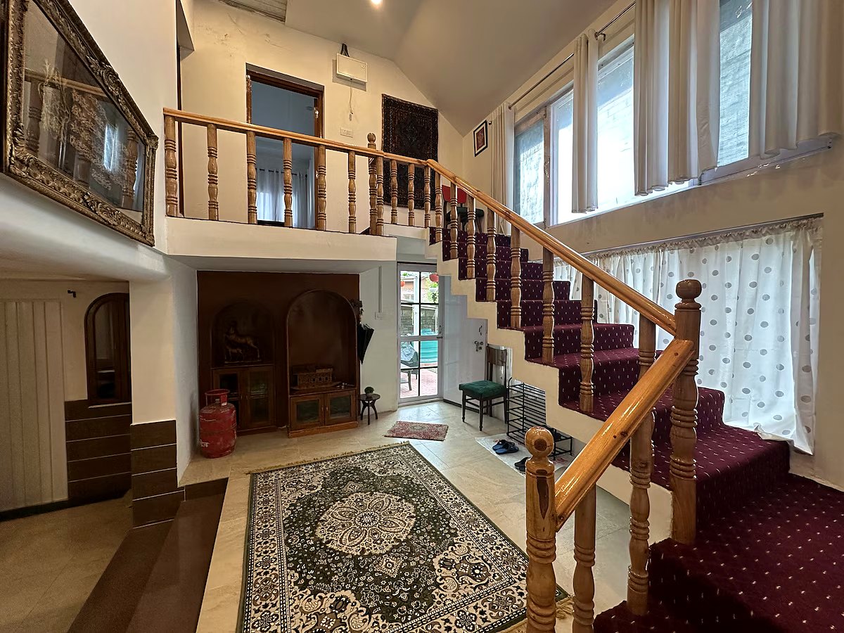 Stairs leading upstairs to bedrooms at Chinar House