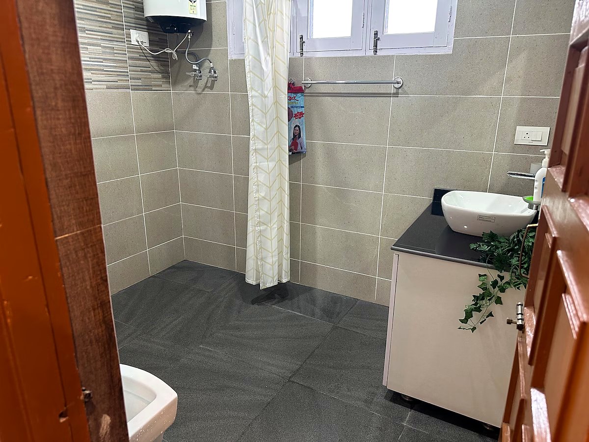 Bathroom attached to the master bedroom with shower and geyser